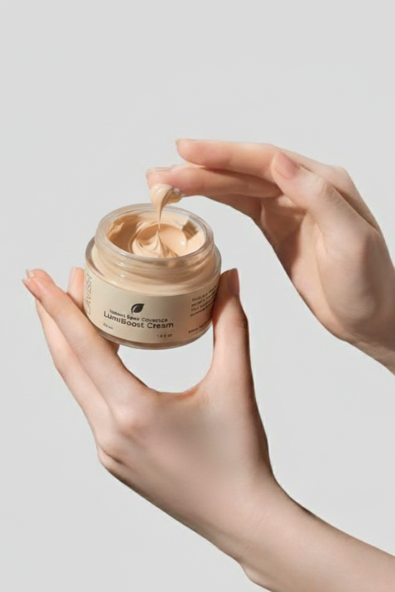 Hand holding a jar of cream with a neutral background