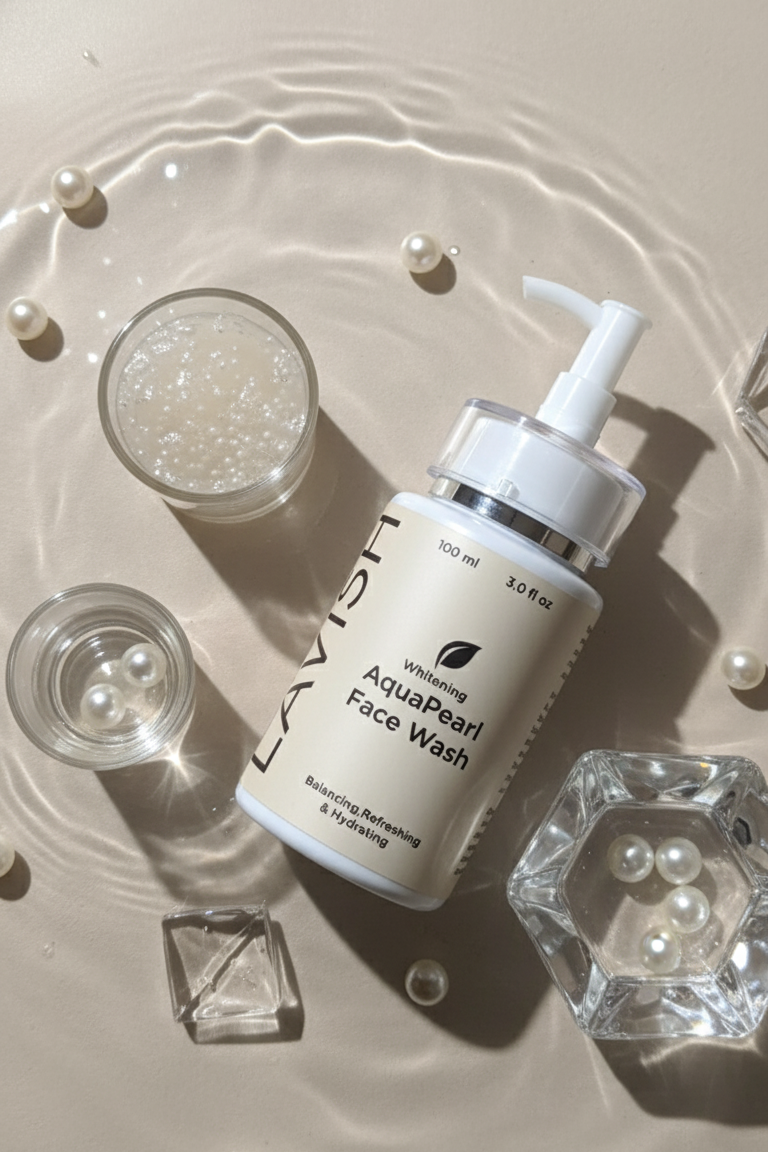 Facial wash bottle with pearls and water droplets on a light background