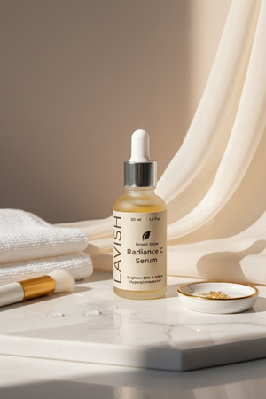 Lavish Radiance C Serum bottle on a marble surface with soft lighting